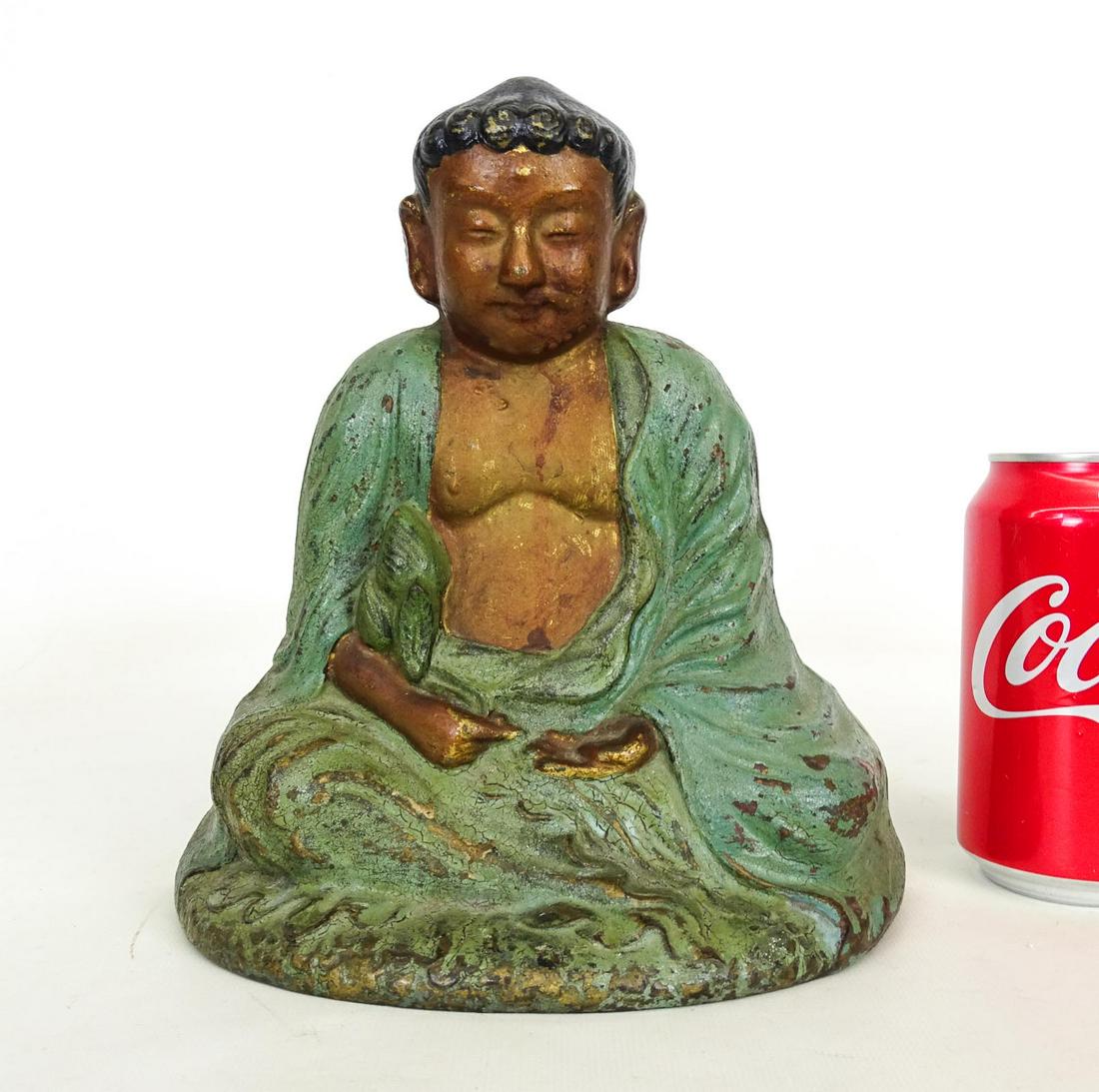 Doorstop: Cast iron painted Buddha doorstop. 8 7/8" Ht..