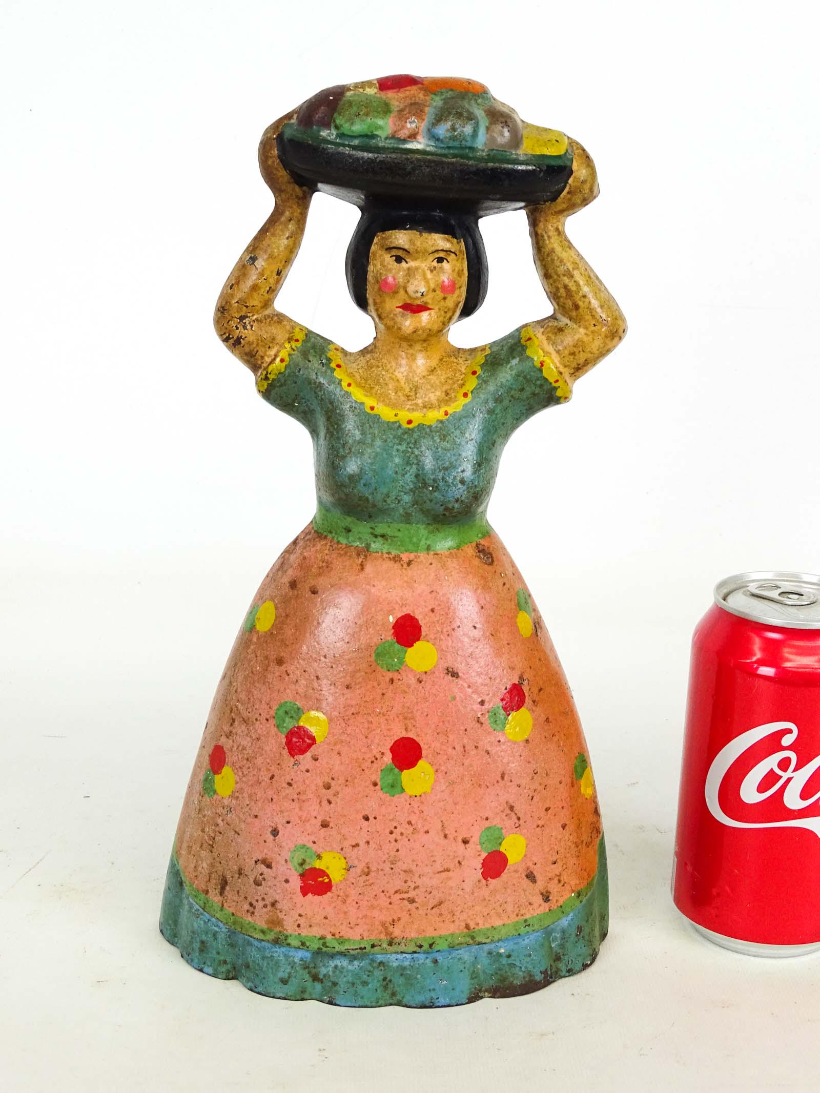 Doorstop: Cast iron painted doorstop, "Tropical Woman with Fruit", 6" W., 12 3/4" Ht.. Ref: The Doorstop Book, Smith p. 187.