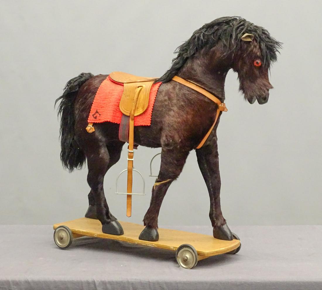 Child's Riding Platform Horse: Child's riding platform horse. 30" L., 30" Ht..
