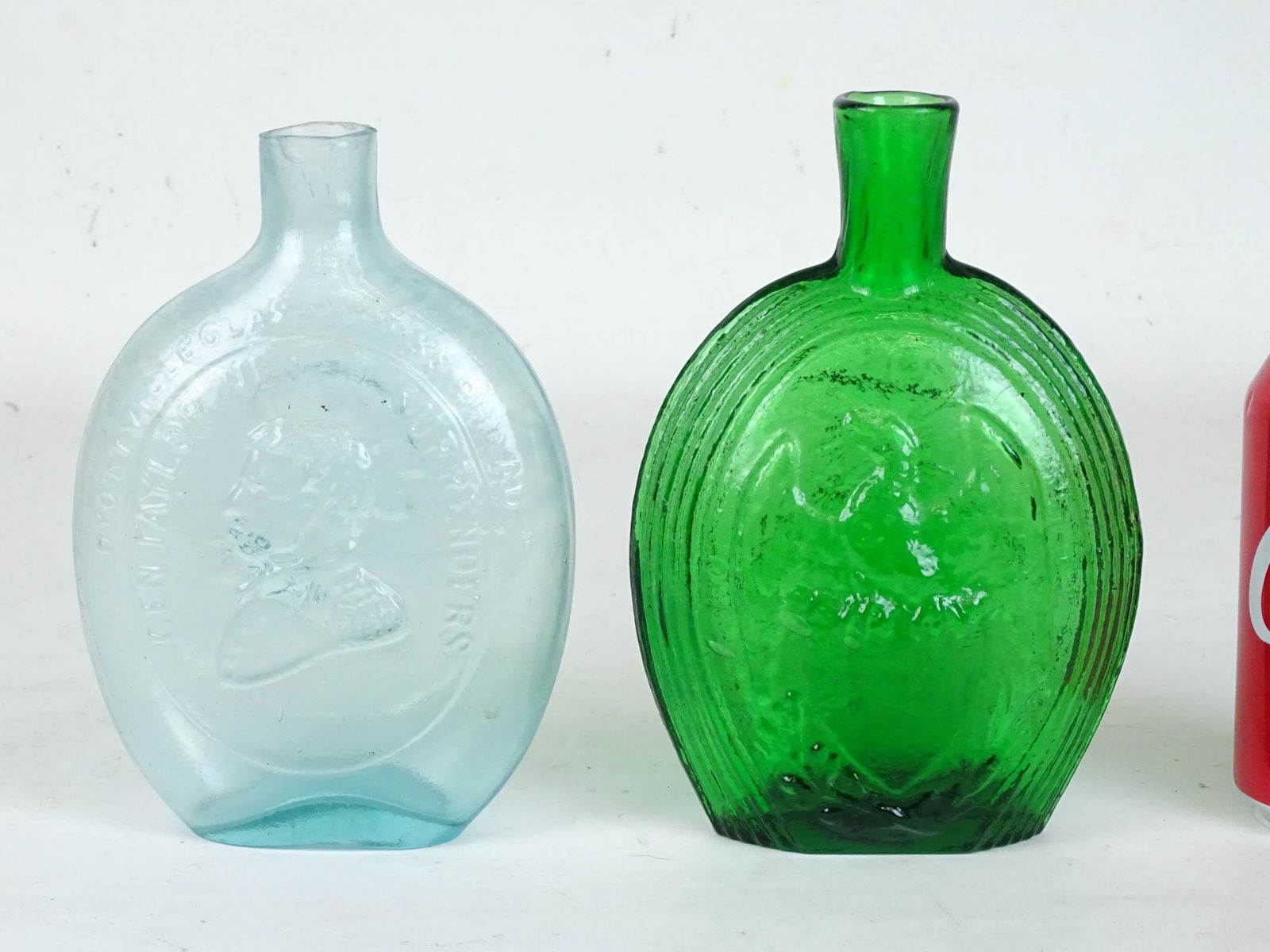 Bottle Lot: Lot (2) Historical type flasks. Approx. 7 1/2" Ht. Washington/Taylor flask has crack.
