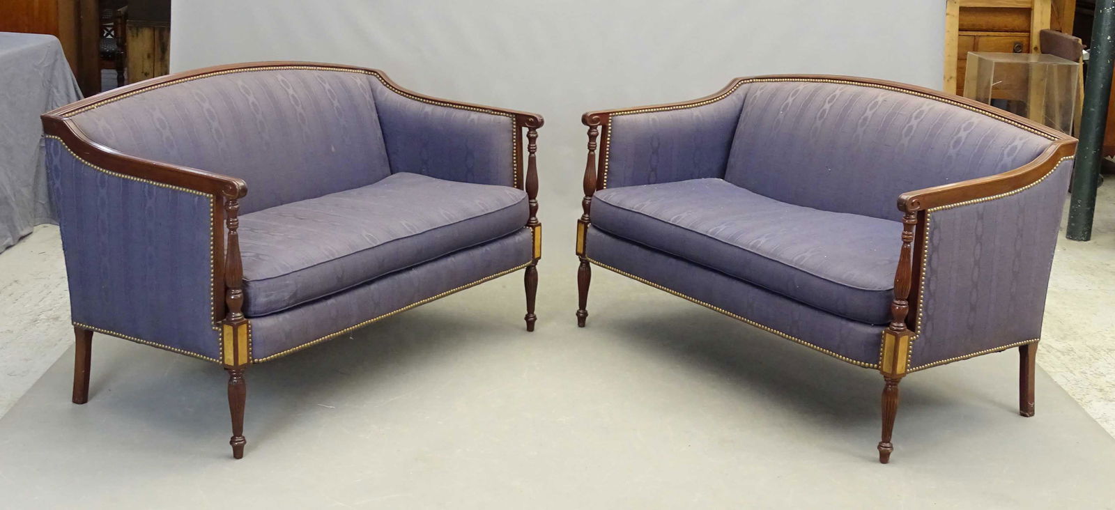 Pair Decorative Settees: Pair decorative Federal style settees. 53" W.. Labeled Hickory Chair, North Carolina.