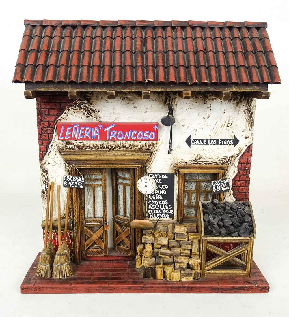 Model of a Spanish Storefront: Leneria Troncoso. Miniature general storefront. Displays of brooms, coal, wood chips, etc. Signs in Spanish. 13 1/2" x 4" x 15".