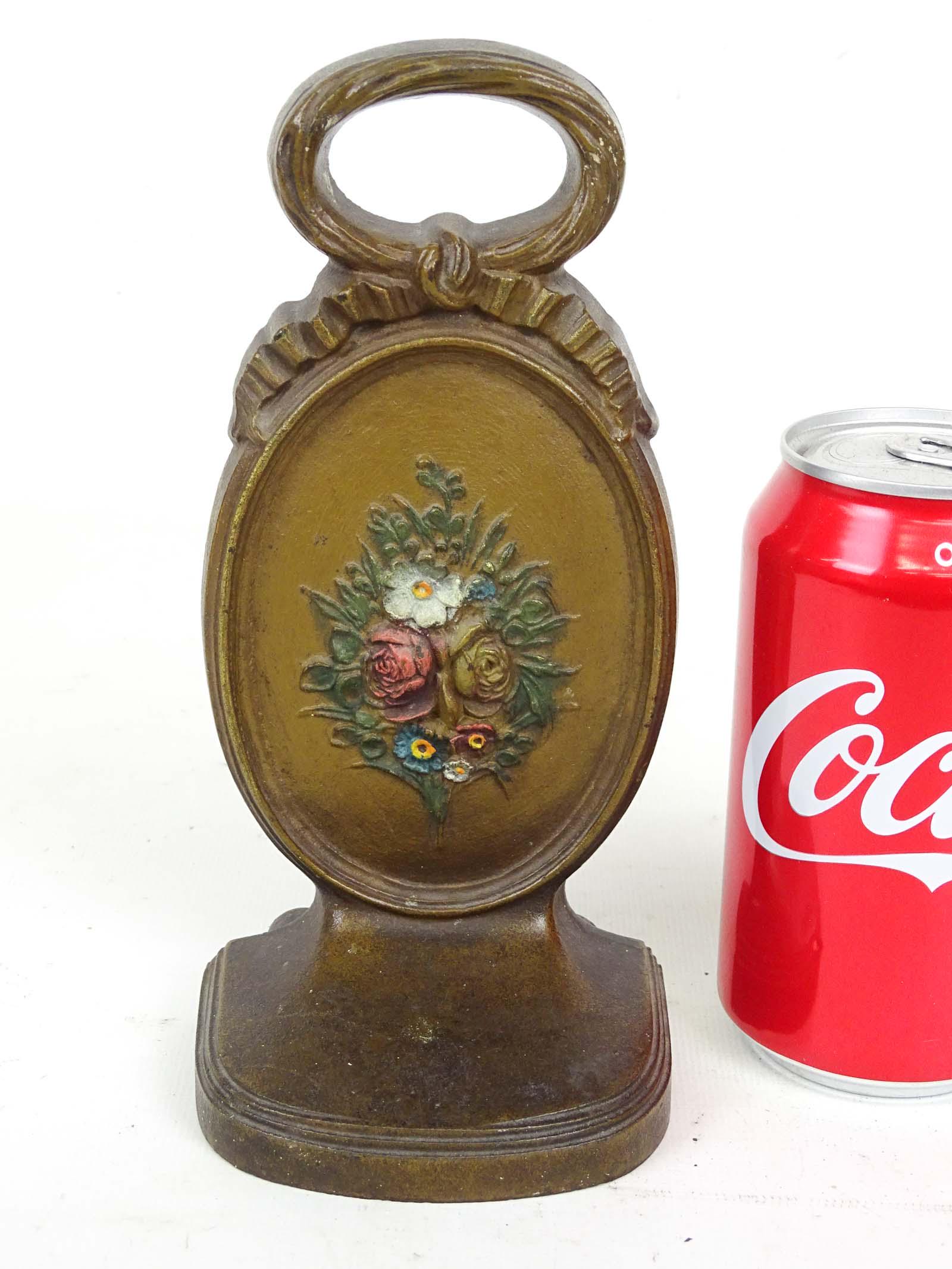 Doorstop: Bradley & Hubbard cast iron Floral-Oval doorstop. 7 5/8" Ht..
