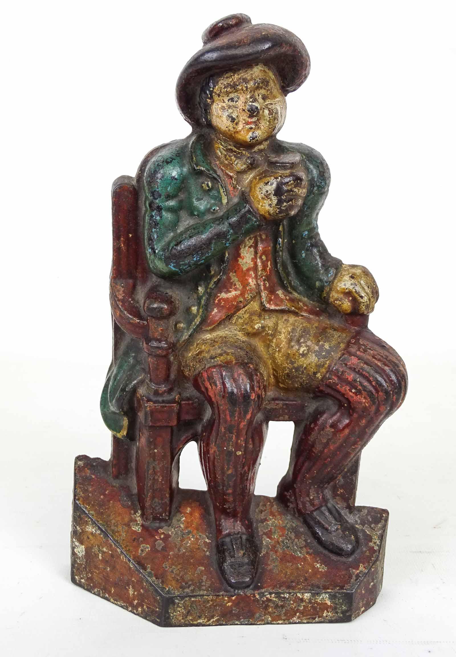 Doorstop: Cast iron Man in Chair with Ale Mug doorstop. 10 1/2" Ht..