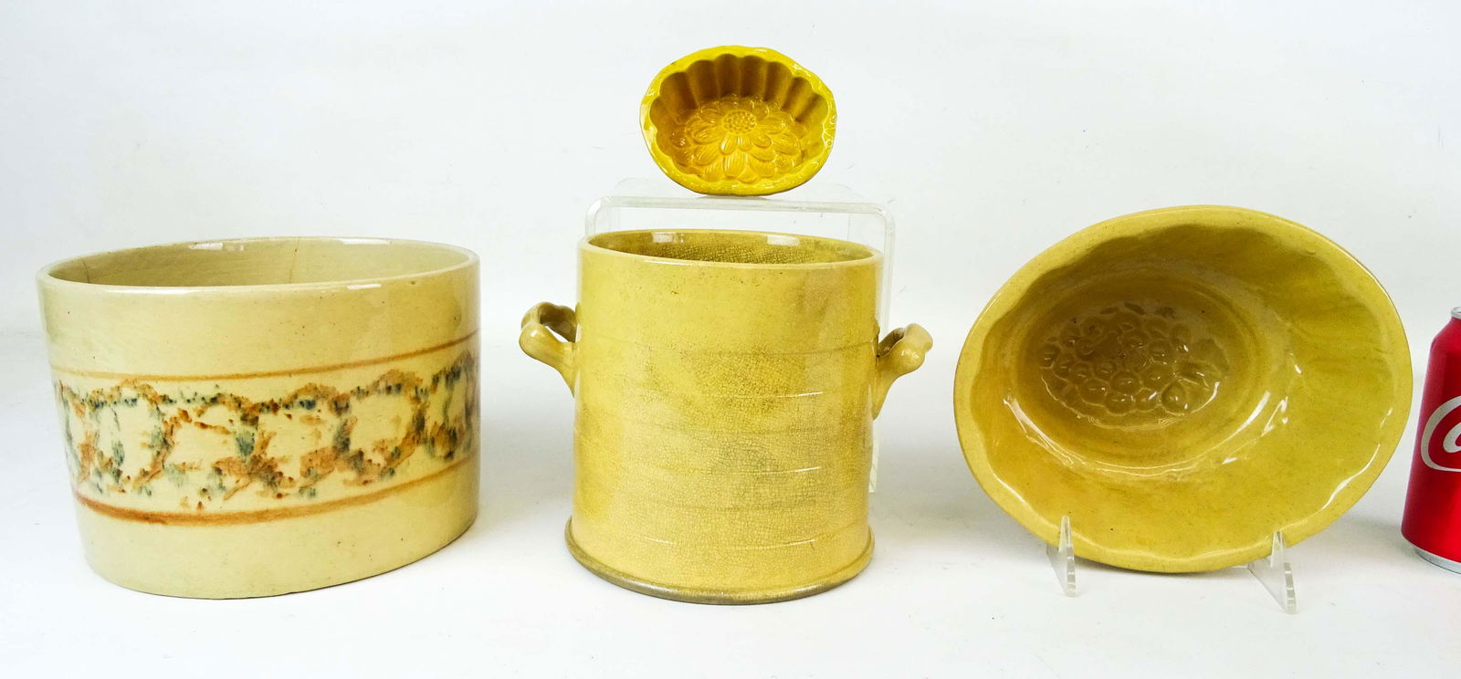 Yelloware Lot: Lot (4) pieces of early yelloware including (2) molds, spongeware crock and two handled jar. Imperfections.