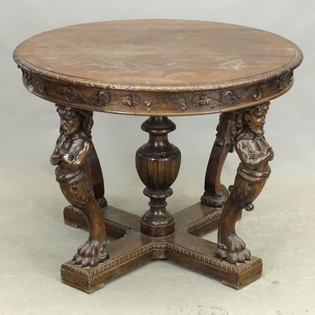 Early Center Table with Full Carved Figures: Early center table with full carved figures. 39 1/2" D., 30 1/2" Ht..