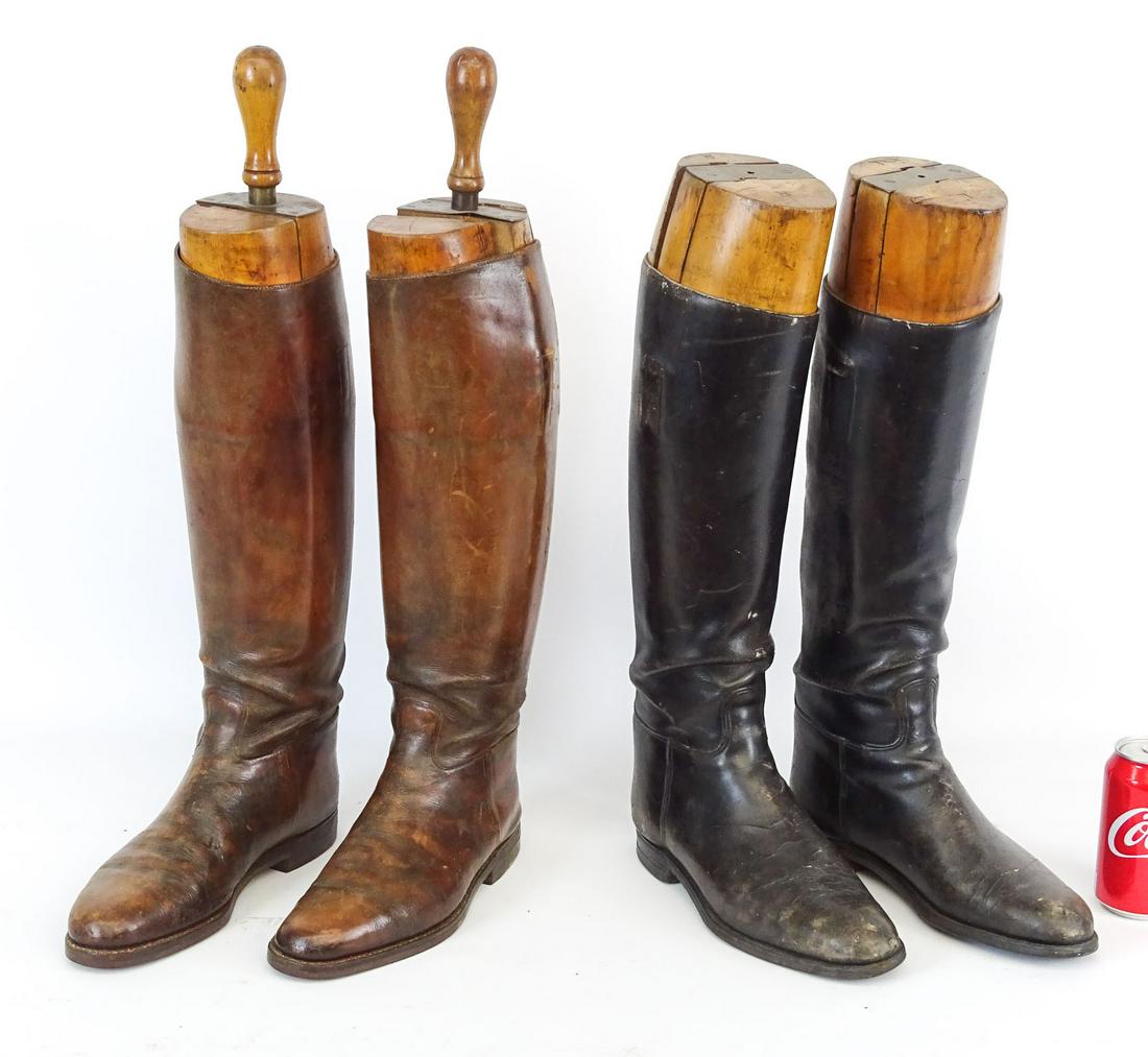 Riding Boots with Stretchers: Two pair of riding boots with wooden stretchers.
