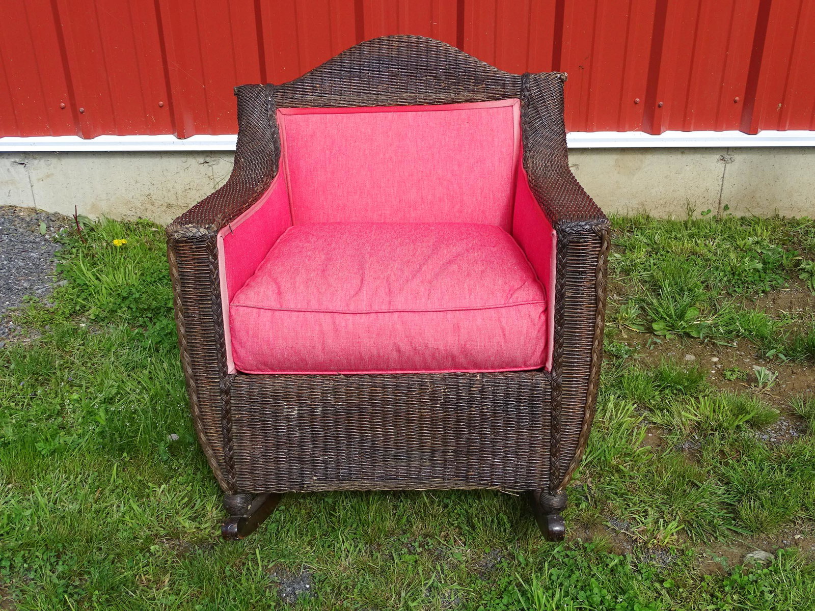 Wicker Rocker: Wicker rocker with upholstered sides. 33" Ht. x 21" seat Ht..