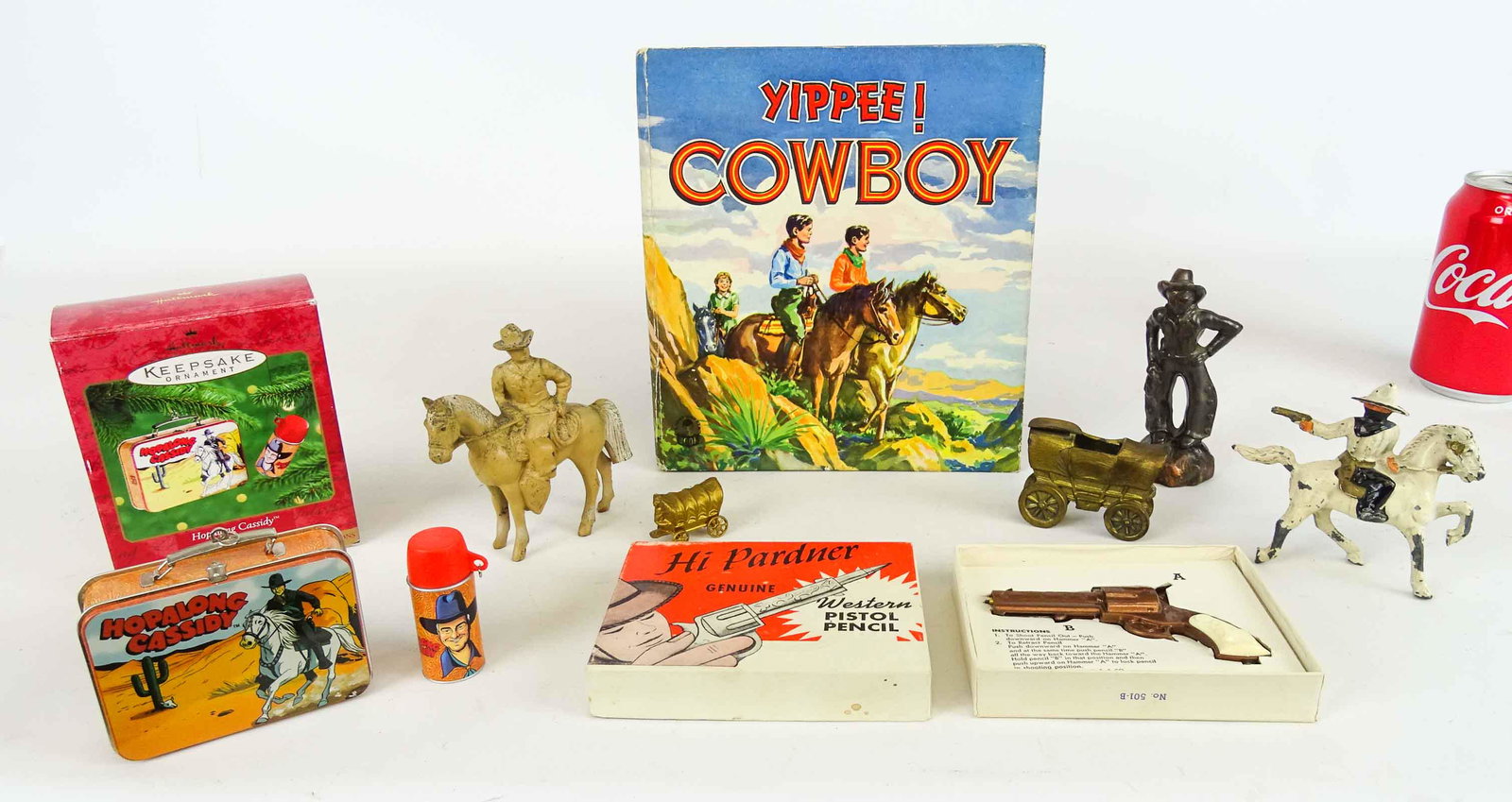 Cowboy Lot: Cowboy lot including miniature wagon ashtray, miniature wagon, cowboy figures, book, pencil pistol etc..