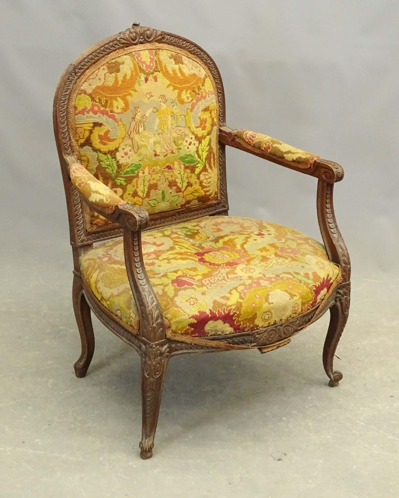 French Armchair: Carved and upholstered French armchair. 16" seat Ht. 37 1/2" overall Ht..