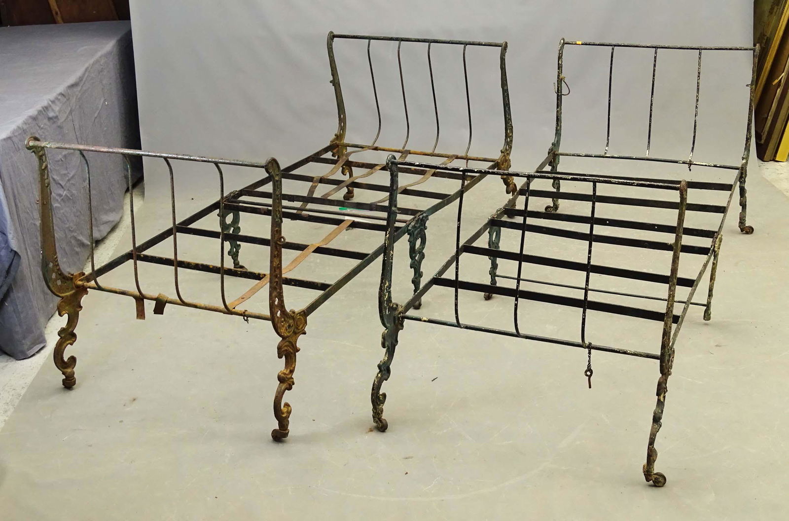 19th c. Iron Daybeds: Pair of ornate 19th c. cast iron daybeds.