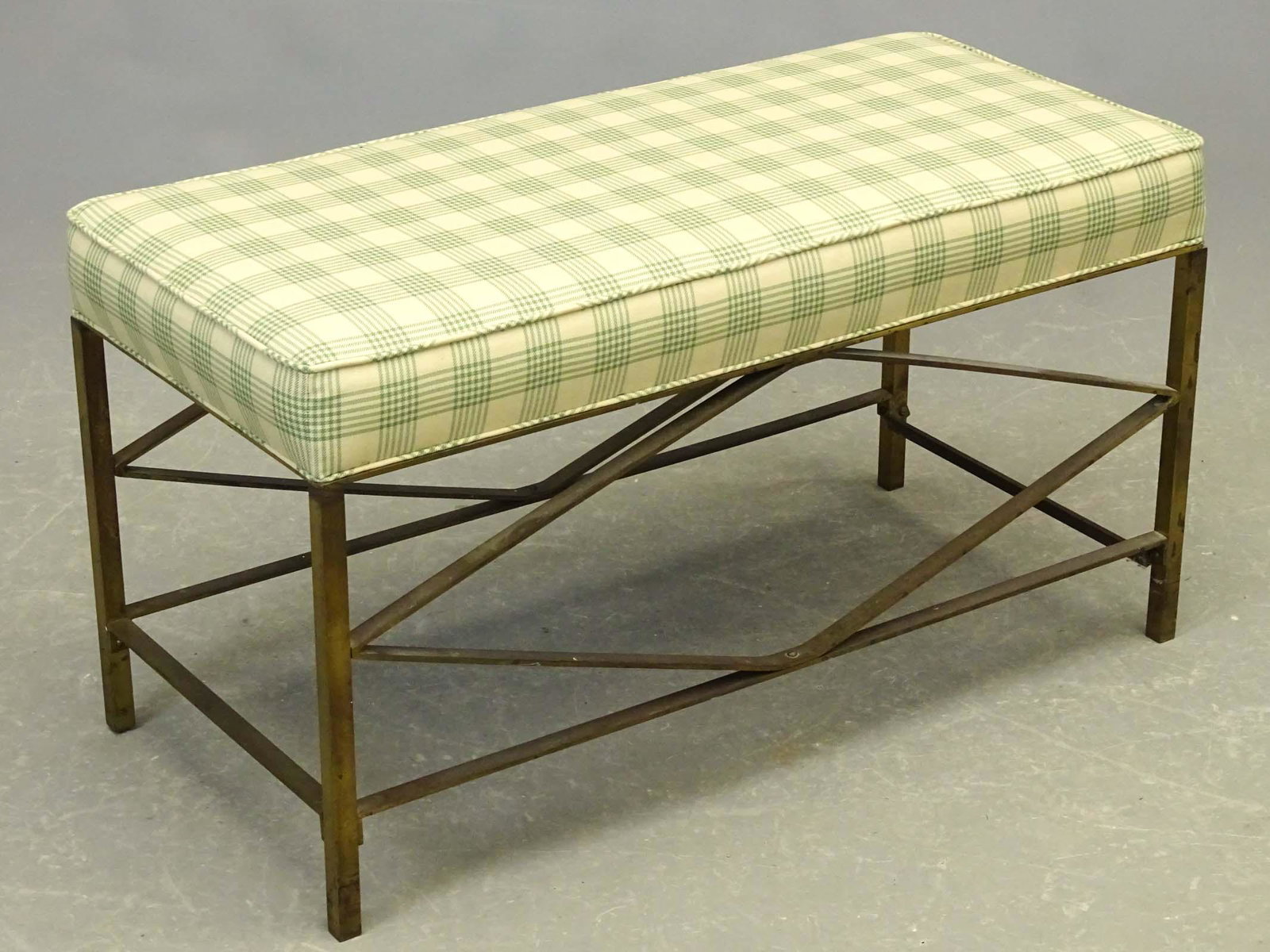 Brass Upholstered Settee: Brass upholstered settee. 34" x 16" x 19".