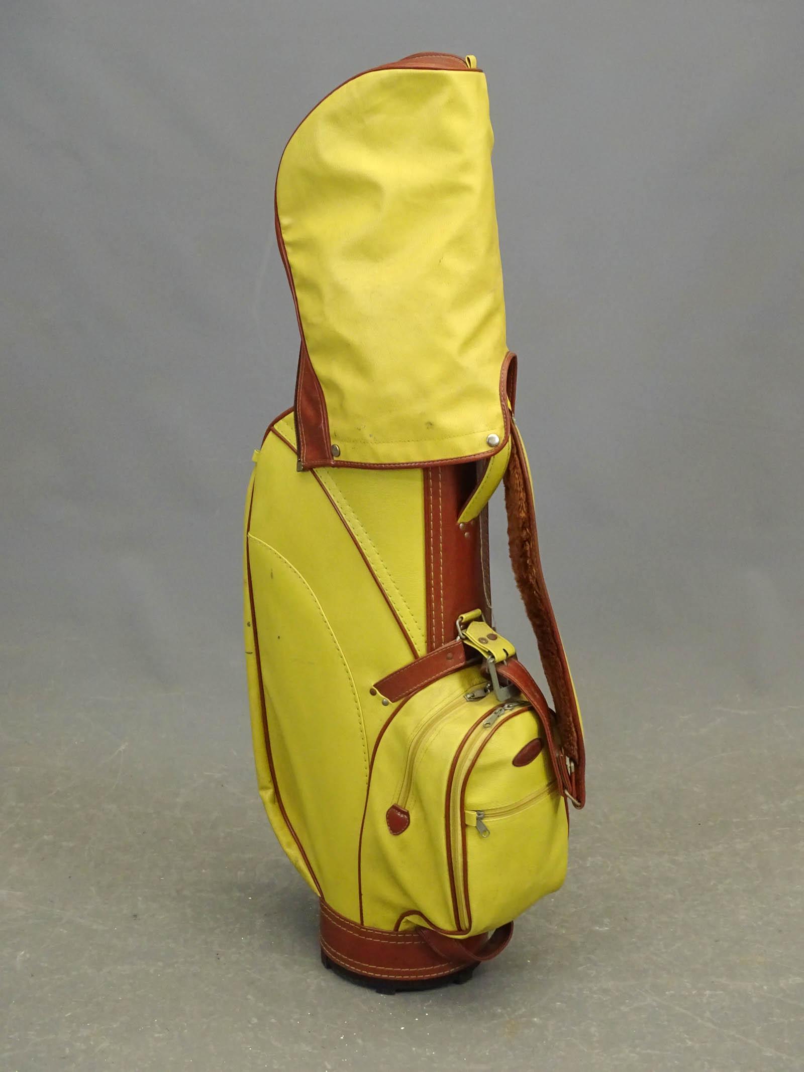 Golf Clubs: Set of golf clubs with bag.