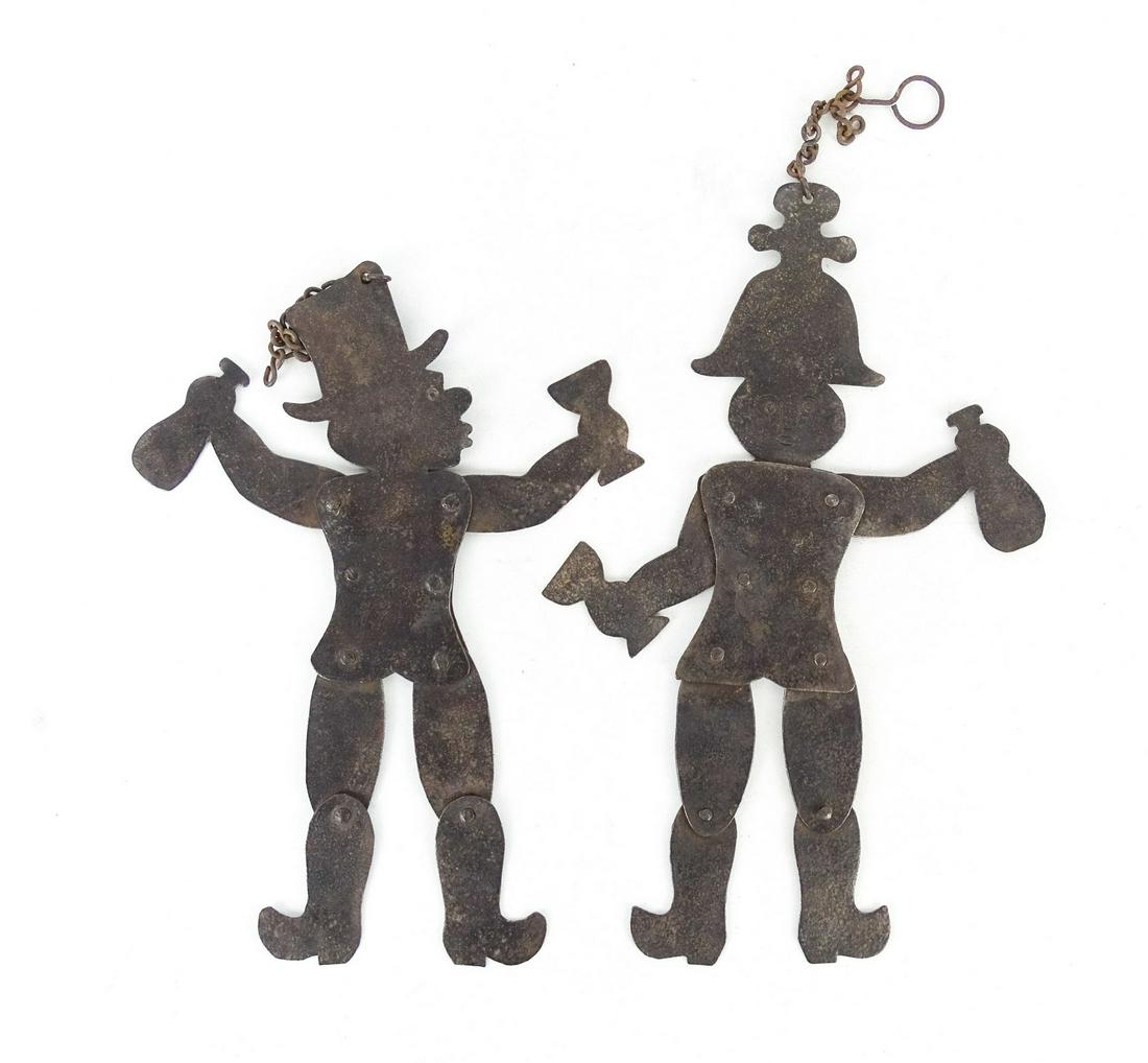 Iron Articulating Figures: Two iron articulating figures. 11" L..