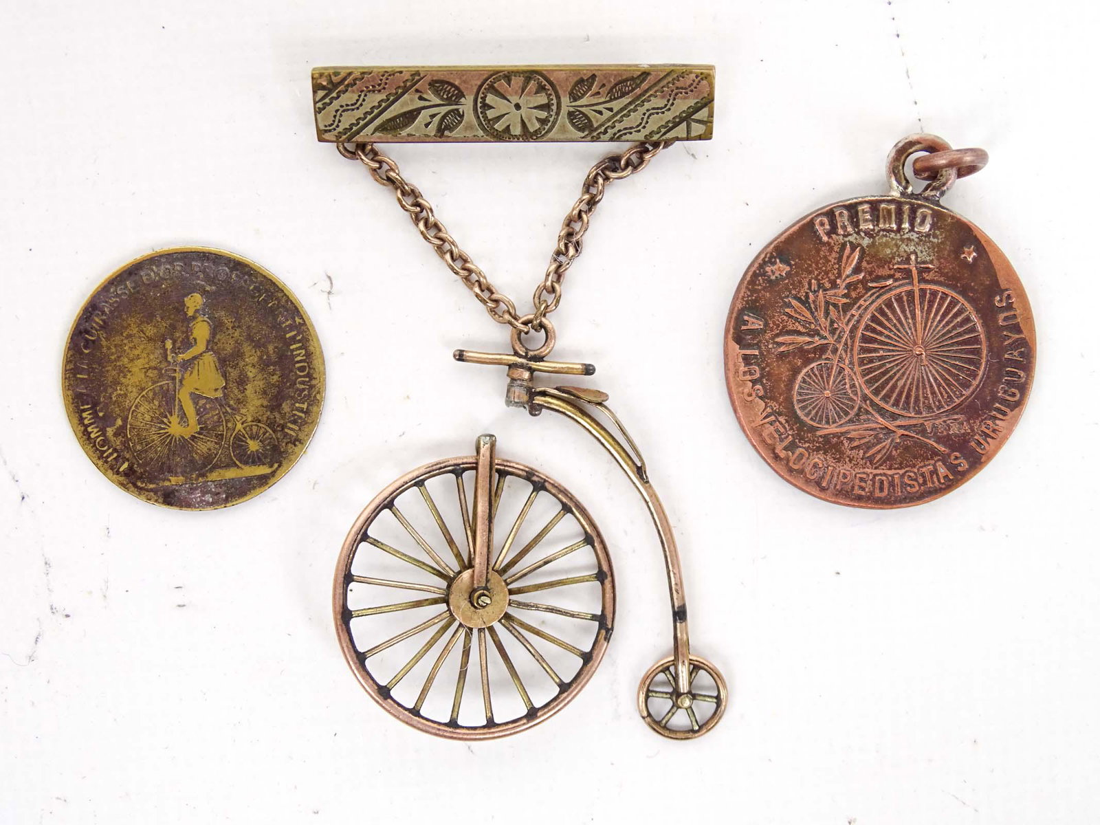 High Wheel Pin Lot: Lot including high wheel pin (wheel separated), high wheel token and medal. Good condition aside from noted.