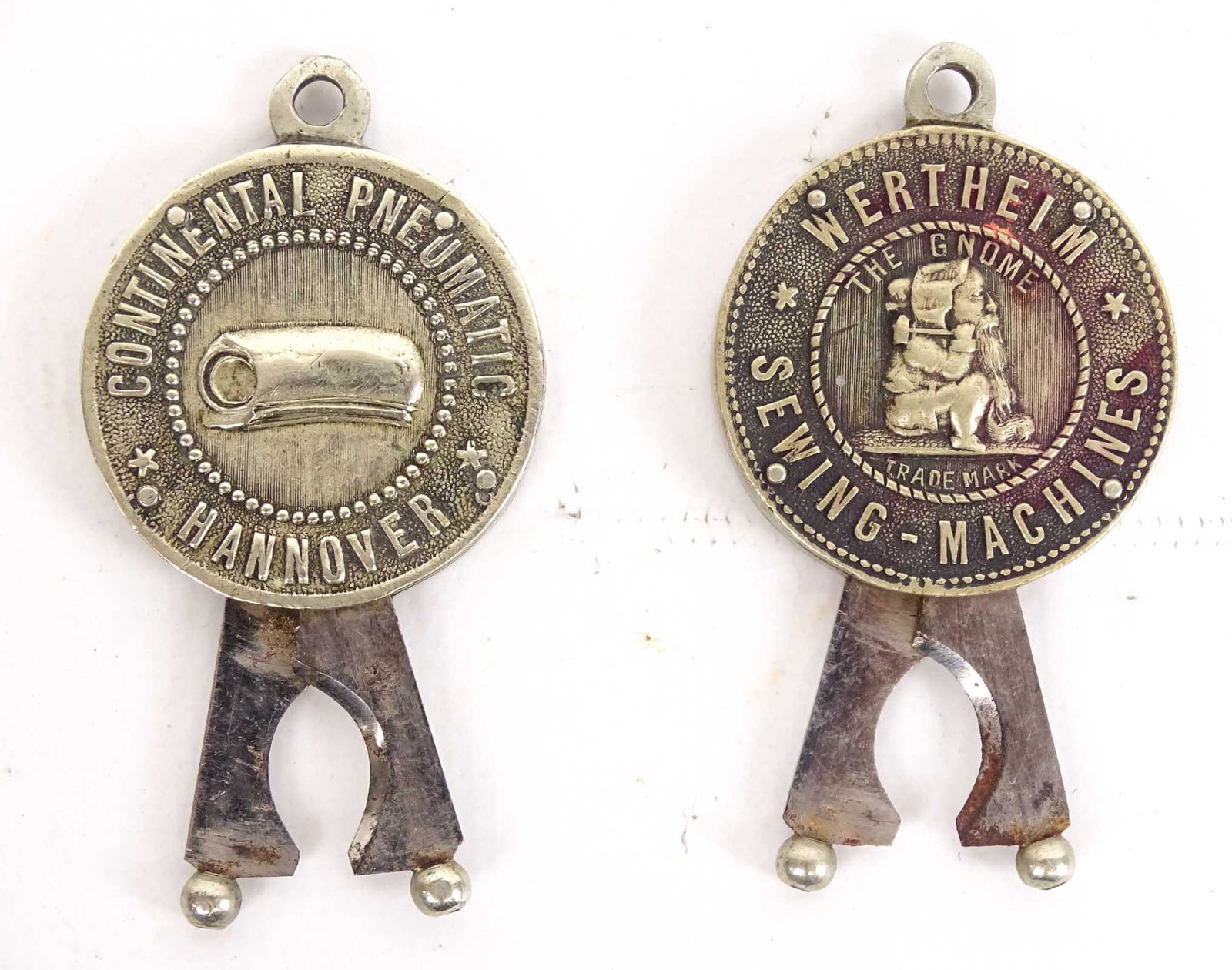 Cigar Cutters: Lot (2) early cigar cutters, "Continental Pneumatic / Hannover" and "Wertherim / Sewing-Machine". Good condition. Case not included.