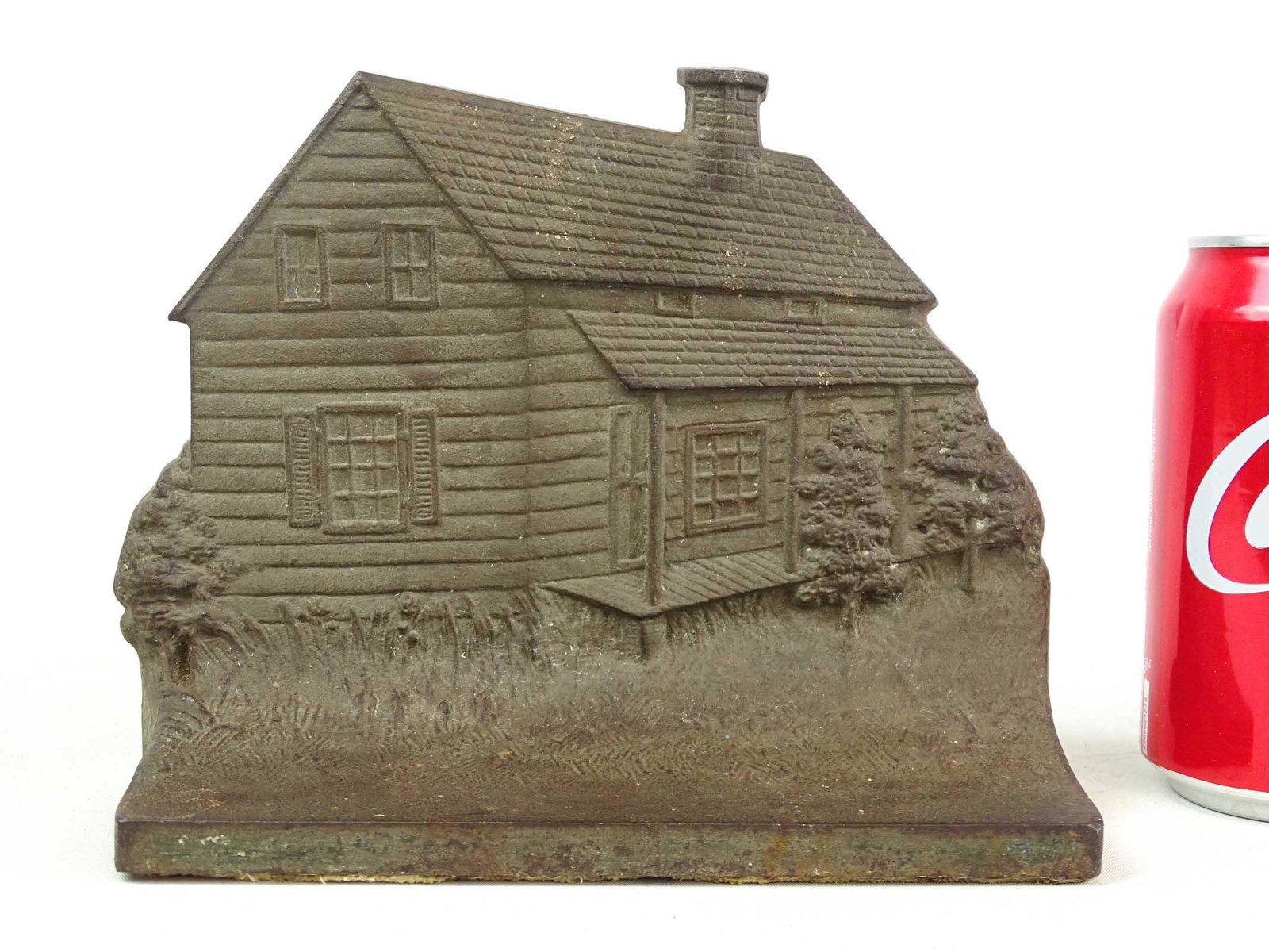 Doorstop: Cast iron Edgar Allen Poe cabin doorstop. 5 7/8" x 7 7/8". MFG. Bradley & Hubbard.