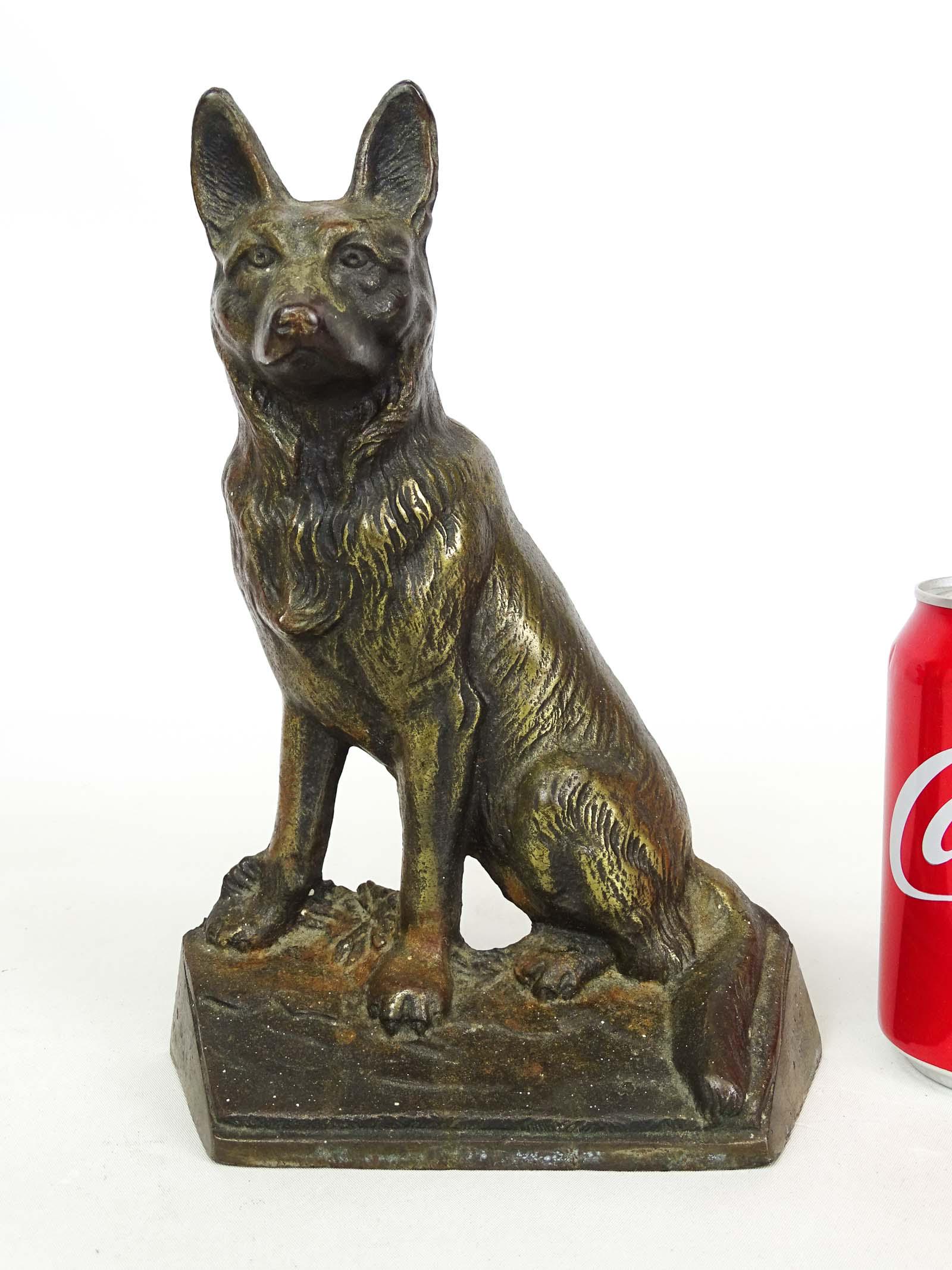 Doorstop: German Shephard: Doorstop: Cast iron sitting German Shepherd. 9 1/2" Ht., 6 3/4" W.. Marked "275".