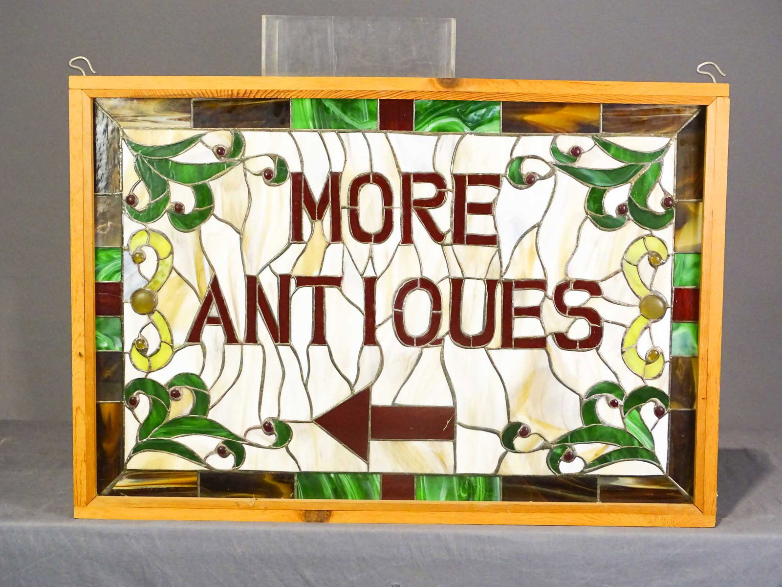 Antiques Sign: Leaded glass sign "MORE ANTIQUES". 26 1/2" x 38", 5 1/2" D..