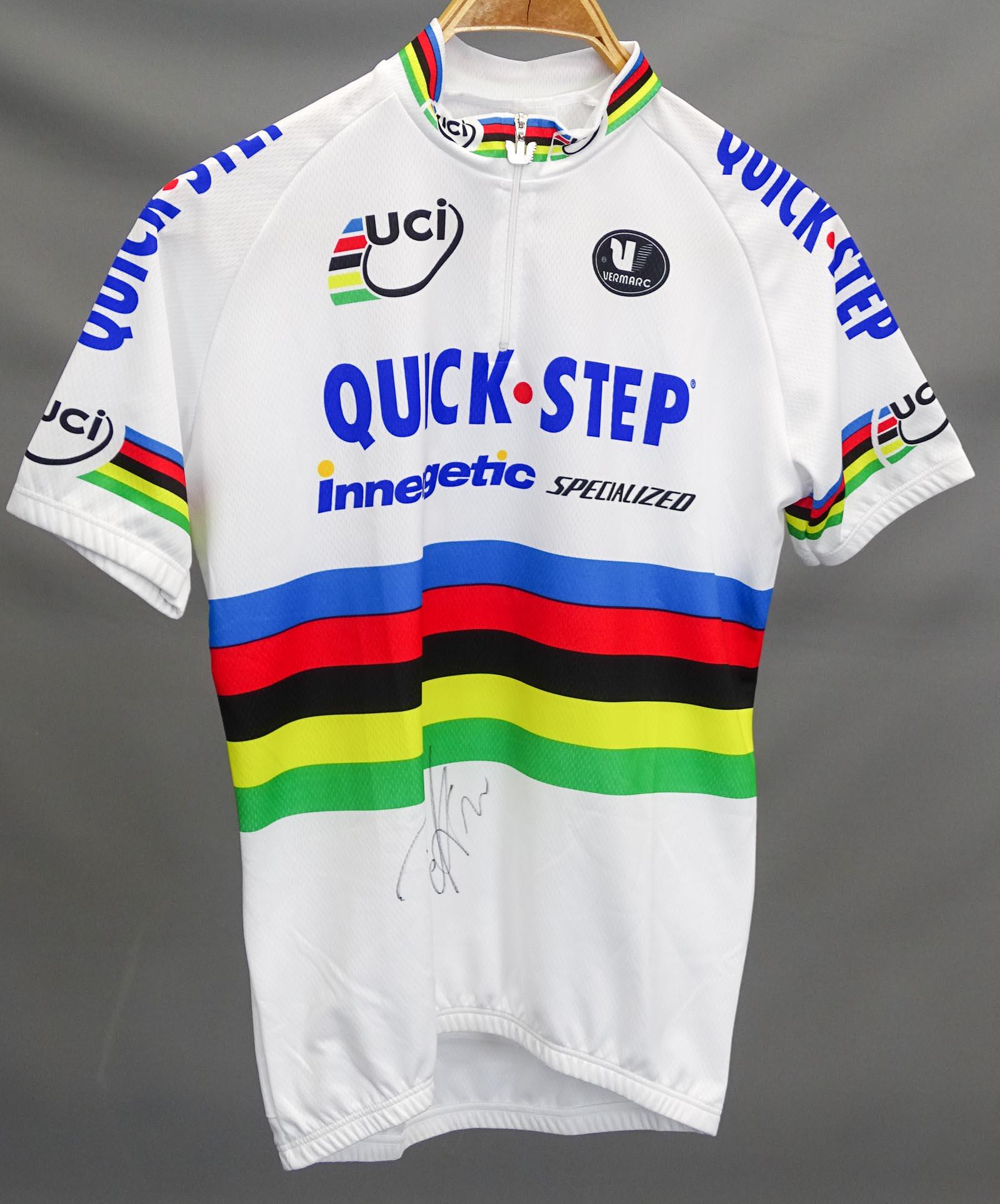 Paolo Bettino Autographed Jersey: Paolo Bettino race worn autographed Rainbow jersey. Bettini won a gold medal at the 2004 Olympics. COA from Olaf Wiese. Good condition, unused.