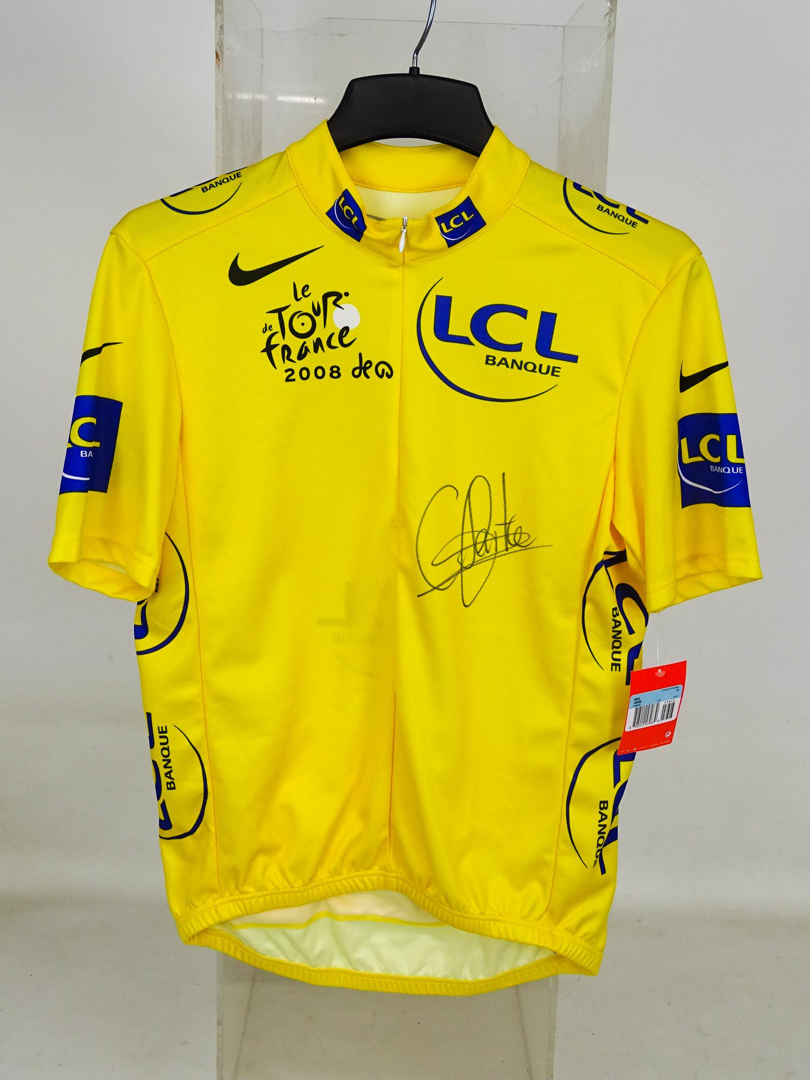 Carlos Sastre Autographed Jersey: Carlos Sastre race worn autographed Tour de France jersey. He won 2008 Tour de France and finished in the top ten in fifteen Grand Tours. COA Olaf Wiese. Good condition.