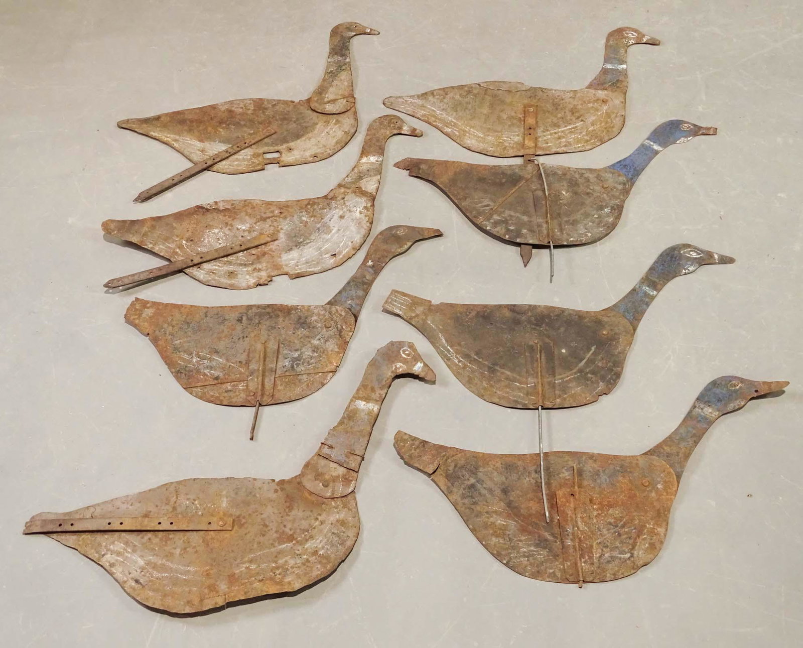 Tin Geese: Set of (8) tin yard geese with moveable necks. 27" L..