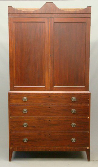 19th c. New York Linen Press: 19th c. mahogany N.Y. "Livingston Family" two part linen press. Top has two doors with interior shelves and slide drws., base has four drws. 49" W 23" D 8' 1" Ht.