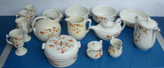Halls China "Tea Leaf" Pattern: Halls China "Tea Leaf" pattern china including serving pieces. Approx. 15 pieces including teapots, covered dishes, water pitcher, cream and sugar, bowls and mugs.