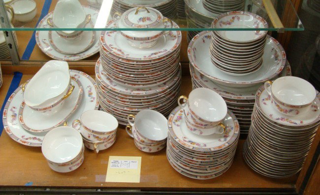 Geman Porcelain: Lot over 70 pieces German dinnerware including plates, cups/'saucers etc. Some damage.