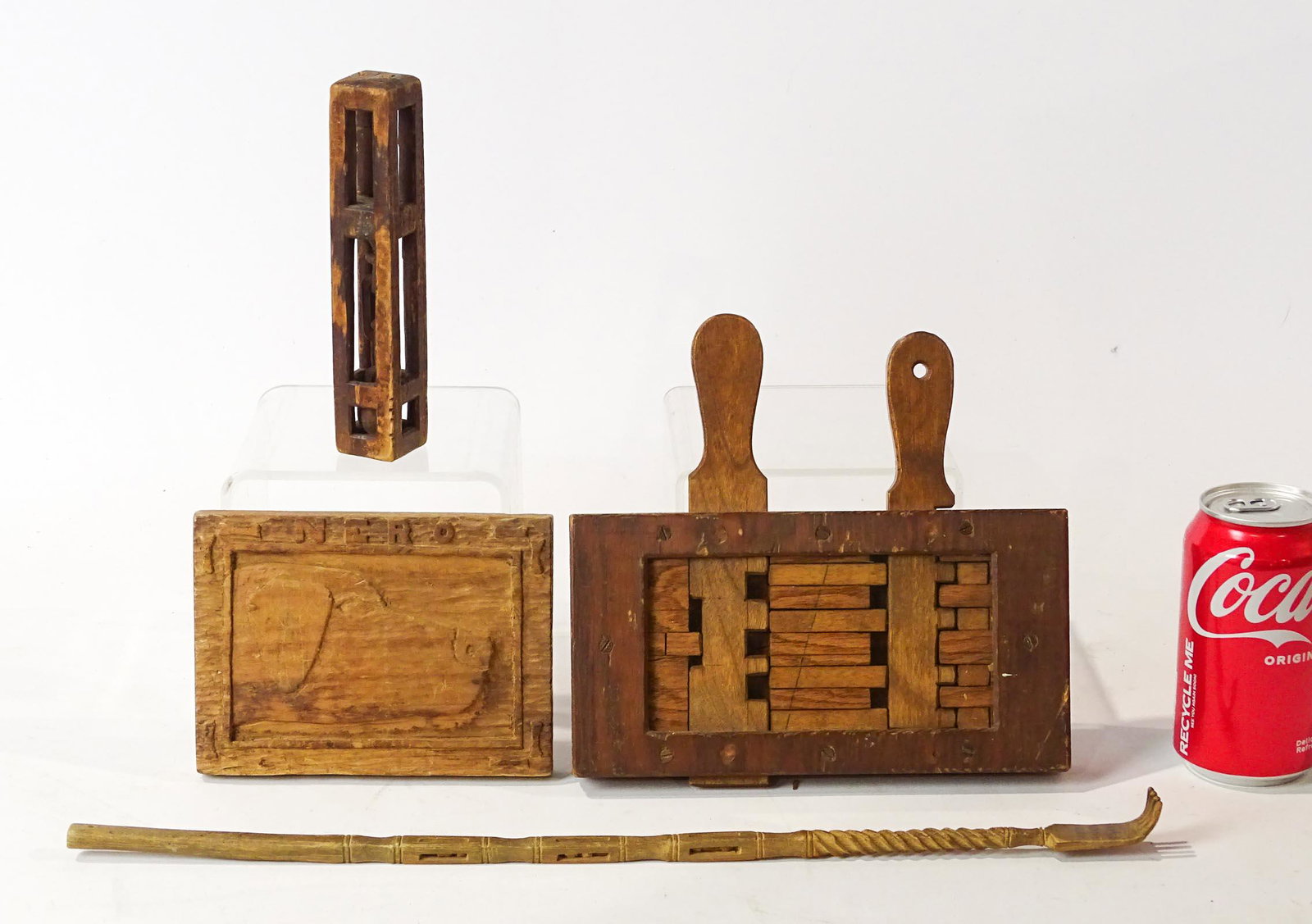 Folk Art Lot: Folk art lot including carved wooden dog plaque "NERO" (4 1/2" x 6 1/4"), folk art handmade game (8 1/2" x 8"), early caged ball and chain (7" L.), wooden back scratcher with caged balls (17 1/2" L.).