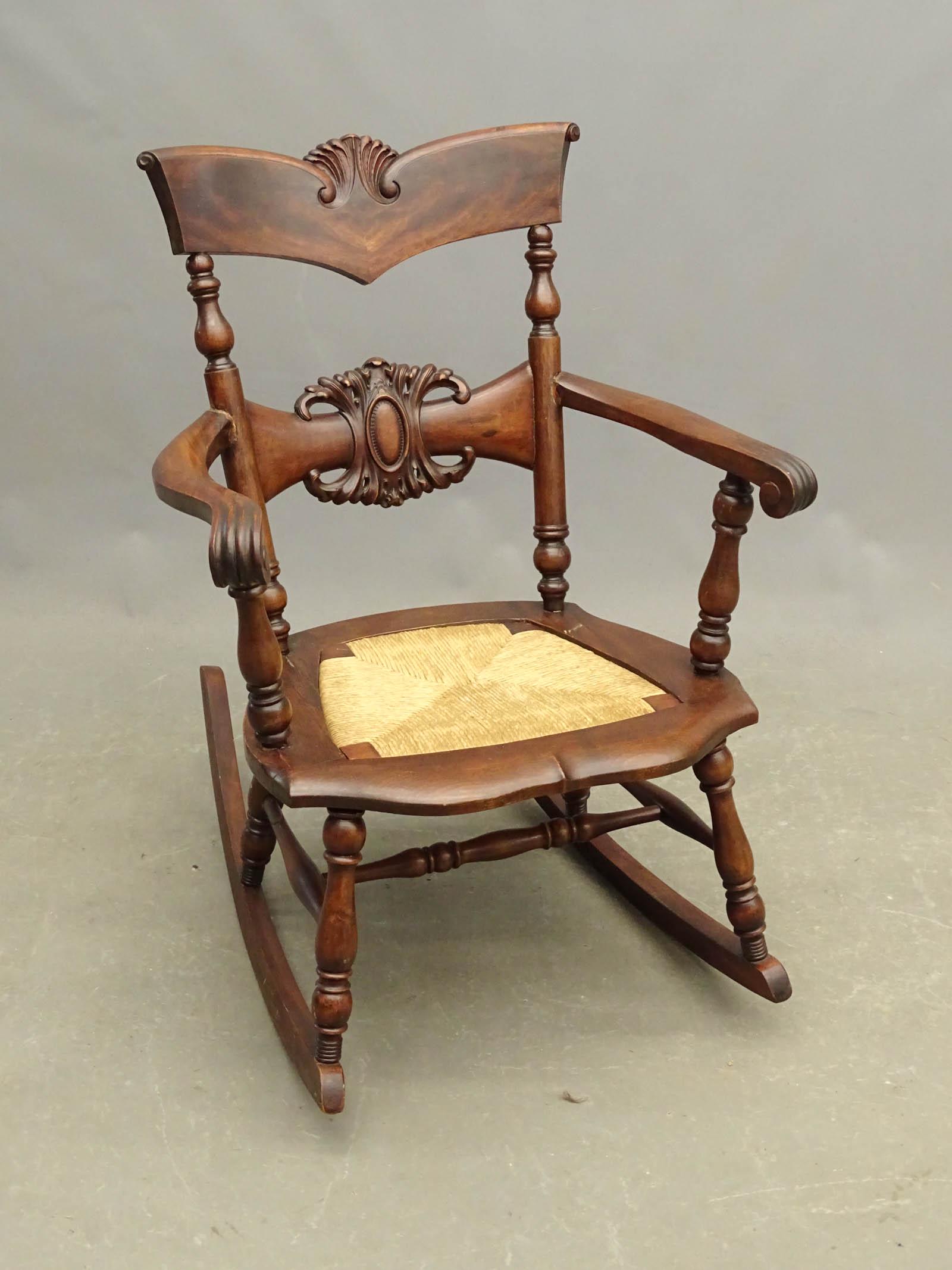 Rocking Chair: C. 1900 mahogany rocking chair. 16" seat Ht., 35 1/2" overall Ht..