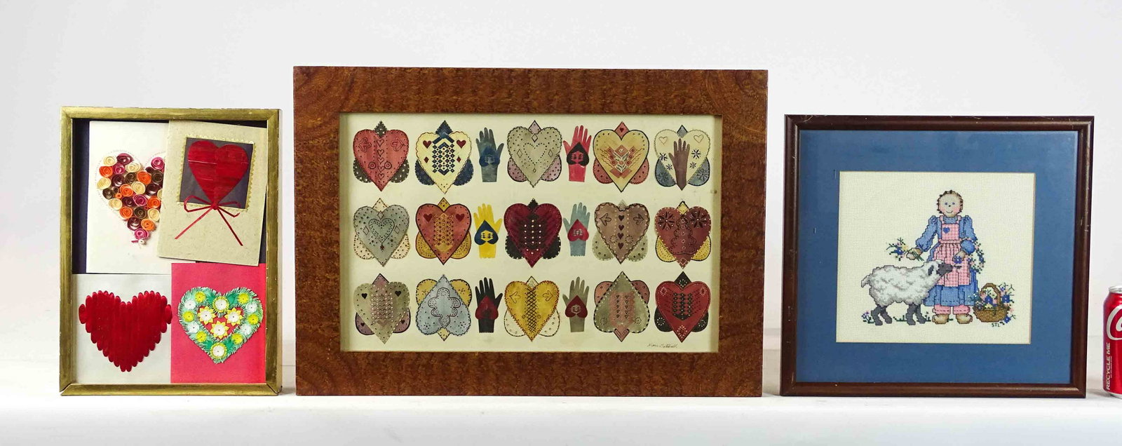 Folk Art lot: Folk Art lot (3) including: Marie Gottshall heart in hand decoupage with decorated frame 14 1/2" x 20 1/2" and Pamela Reed Holeman "Hearts" (loose in frame) 12 1/2" x 9 1/2" and "STL" needlework of gi