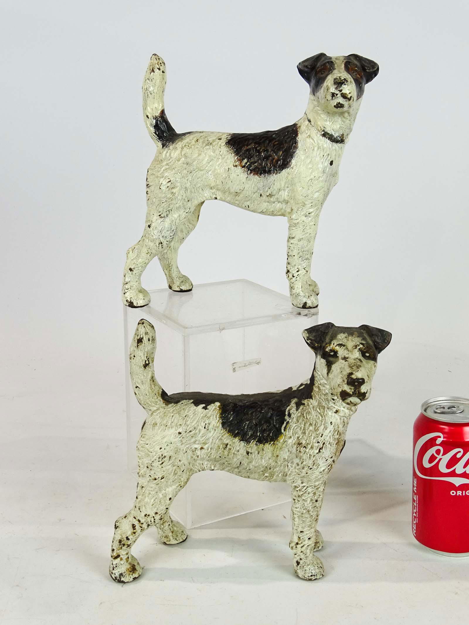 Pair of Dog Doorstops: Pair of dog doorstops in cast iron. 8 1/2" Ht..