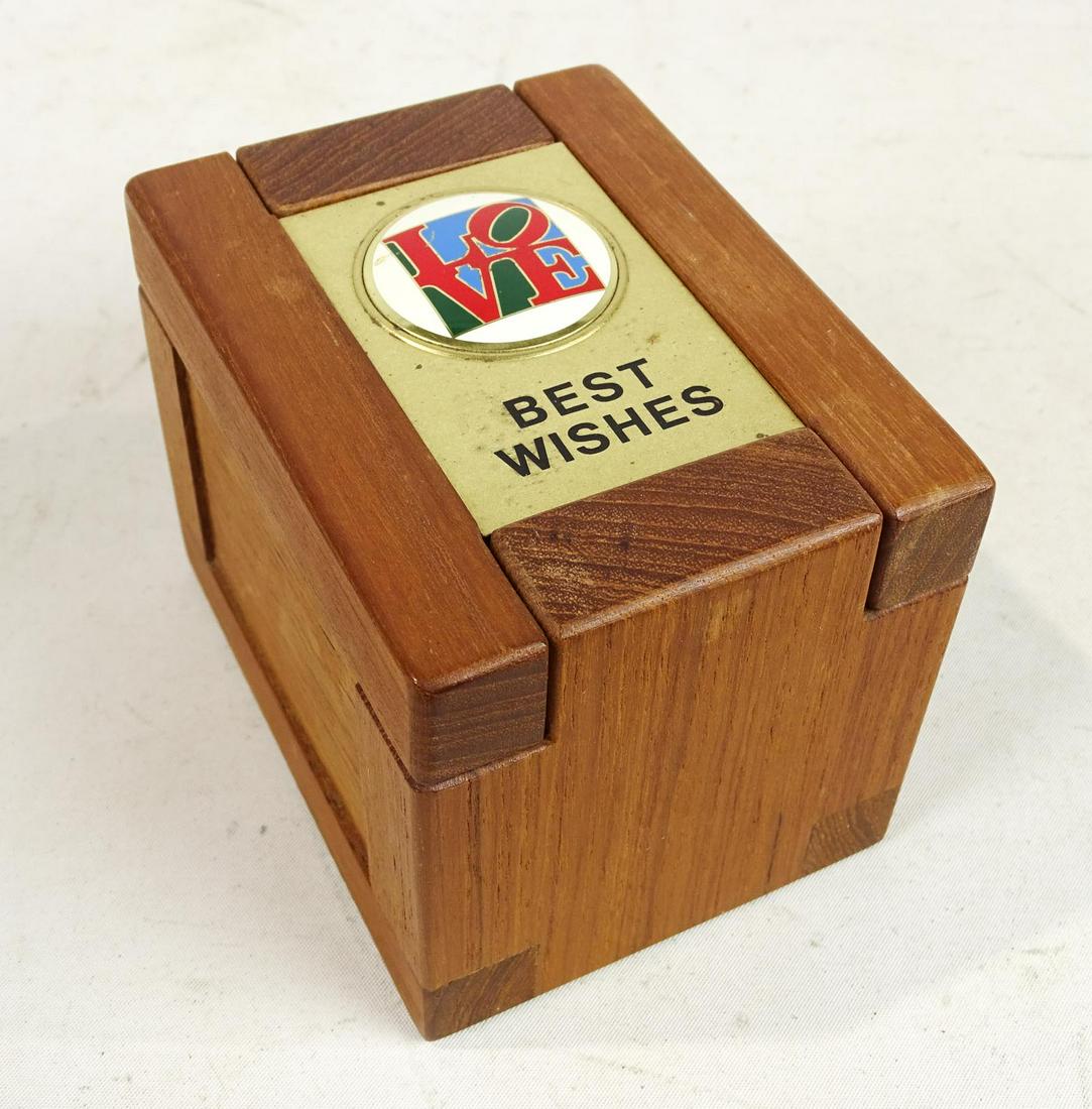 Robert Indiana Teak Box: Robert Indiana teak box with enameled "LOVE" on lid (BEST WISHES). 4 1/2" x 3 1/2" x 3 1/2".