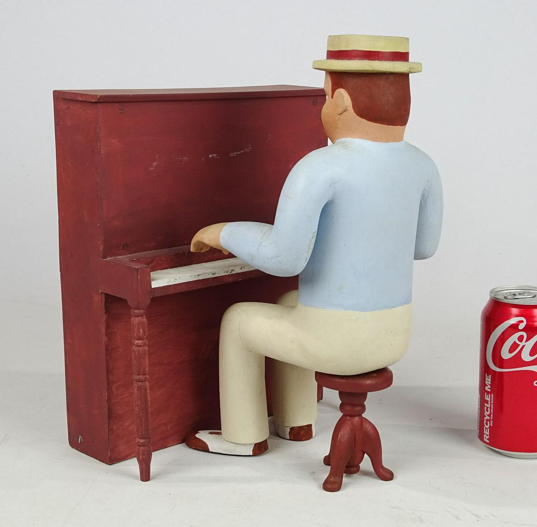 Folk Art Piano Player: Folk art wooden piano player with stool and piano. Figure 12 1/2" Ht..
