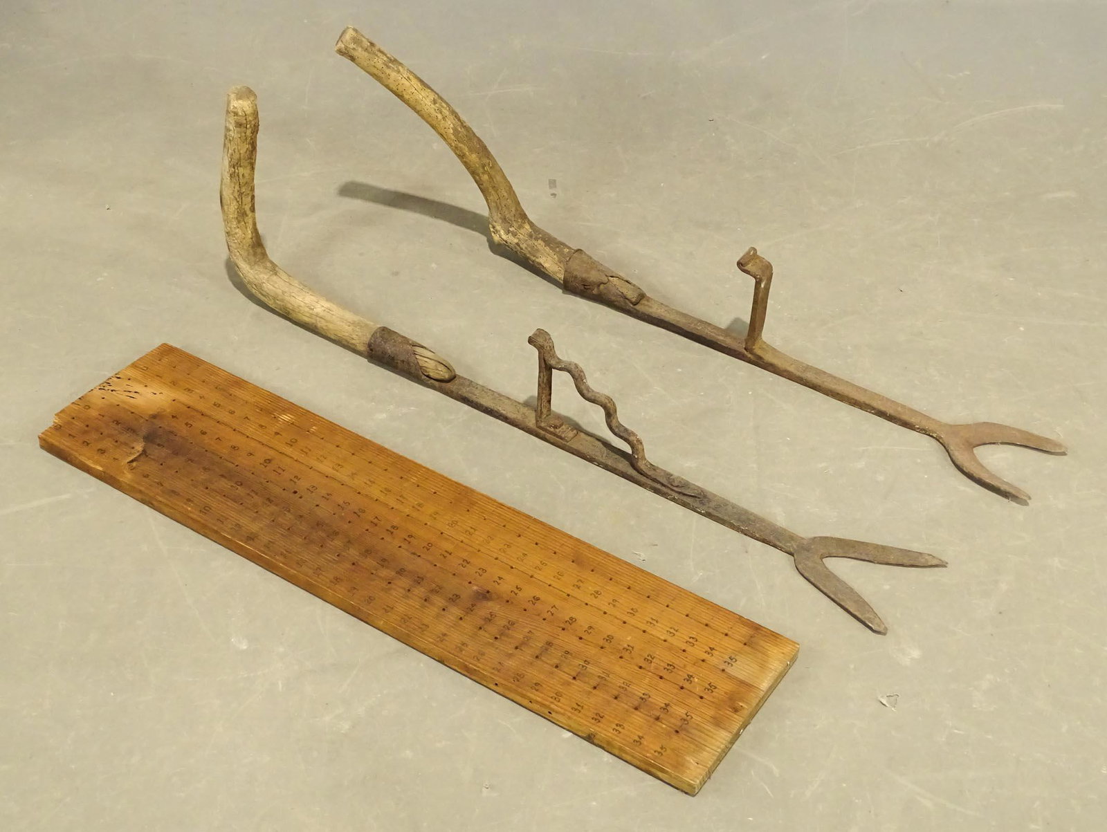 Primitive Lot: Primitive lot including: peg board (use unknown) 38" x 9 1/2", (2) wrought iron and root tools 43" L..