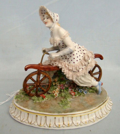 "Luigi Fabris" Lady On Draissine Figurine: C. 1930's "Luigi Fabris" lady on draissine porcelain figurine. 6" Length 6 1/4" Ht. Minor imperfections.