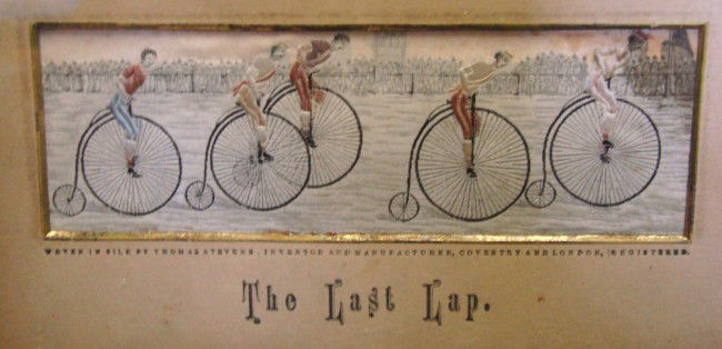 Stevengraph "The Last Lap": Stevengraph "The Last Lap" (highwheel edition) retains orig. mat, back of frame is glass backed to reveal orig. label. "Thomas Stevens, sole inventor and manufacturer, Coventry England". IMage 2" x 5