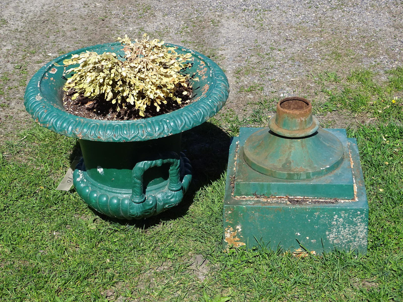 Cast Iron Urn: Cast iron urn. Note loose on base. 24" D., 36" Ht..