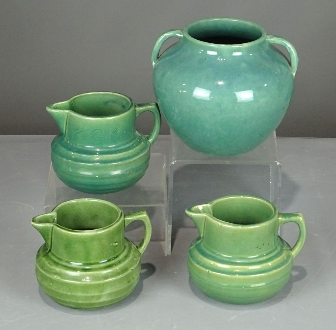 Pottery Lot: Lot (4) pieces including large Zanesville Ohio vase (7" Ht.), (3) green pottery pitchers. 5" Ht..