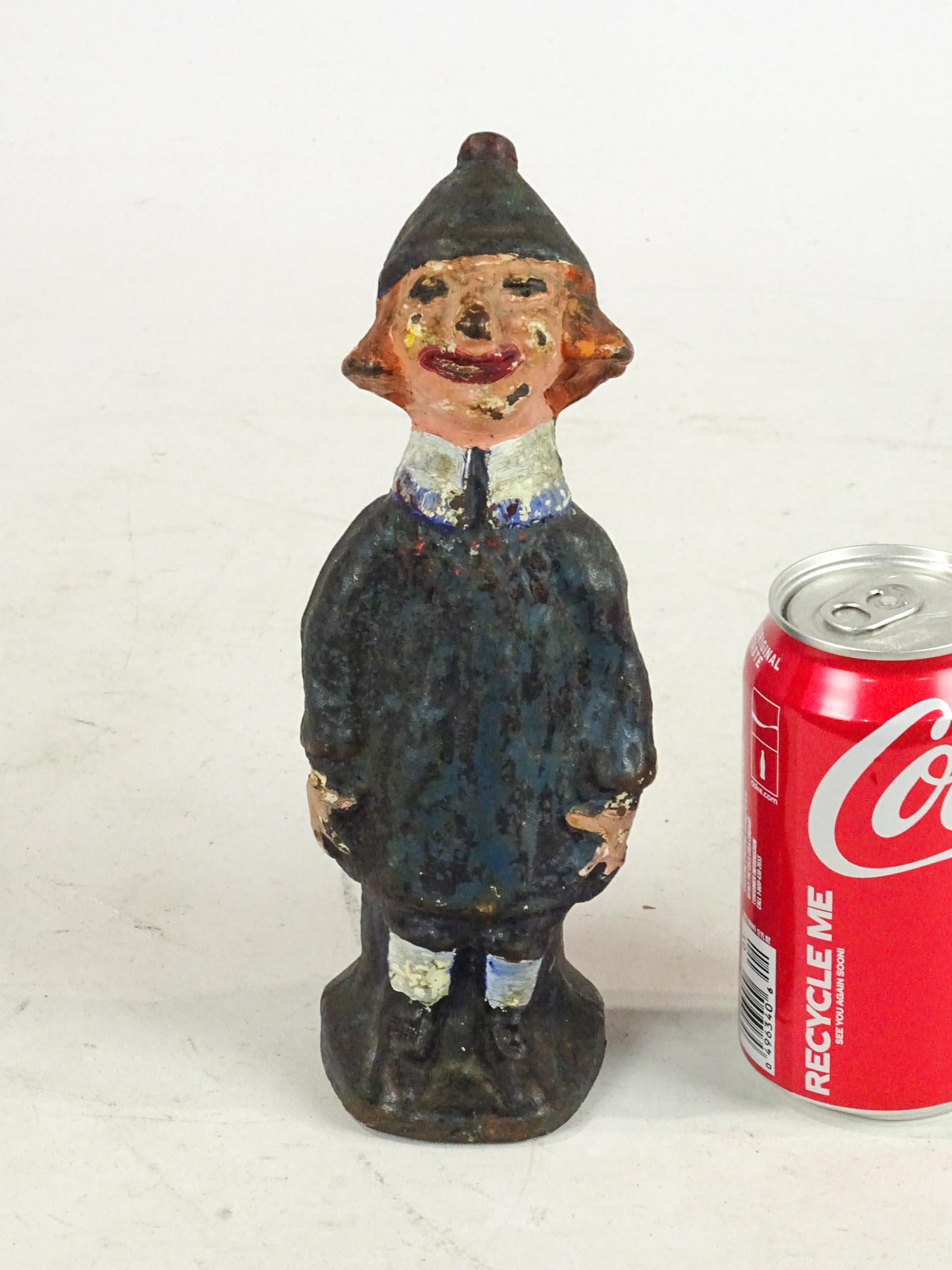 Doorstop: Cast iron Girl with Beanie doorstop. 8 5/8" Ht.. Page 191 The Doorstop Book.