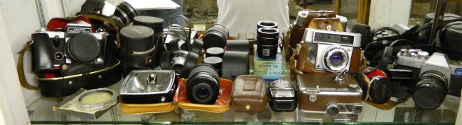 Cameras And Lenses: Camera and lens lot, 17 pcs. including four cameras, six lenses, flash and lighting equipment etc.