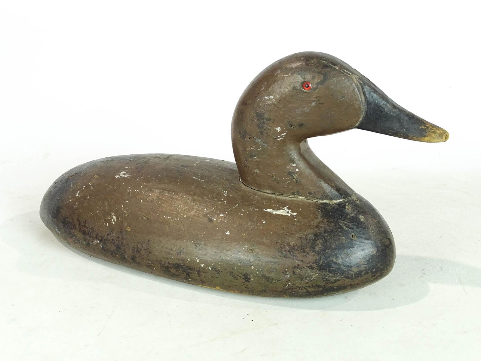 Decoy: Early wooden painted decoy. 14" L., 8 1/2" Ht..