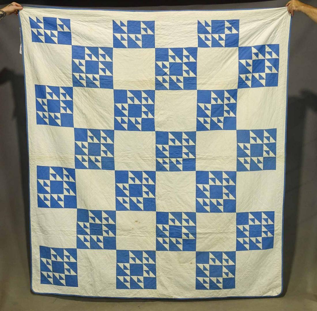 Quilt: C. 1920's blue and white Geometric quilt. 72" x 80". Some imperfections.