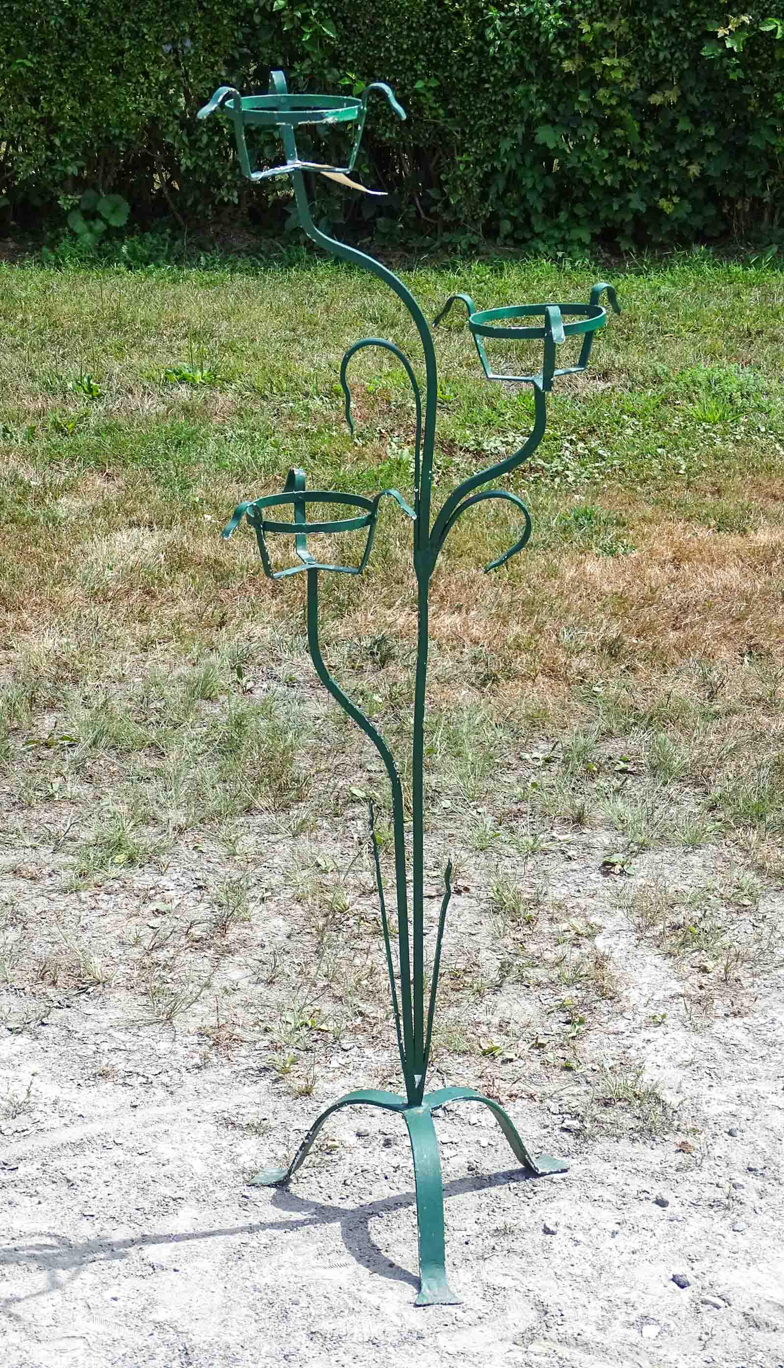 Wrought Iron Plant Holder: Wrought iron plant holder. 55" Ht..