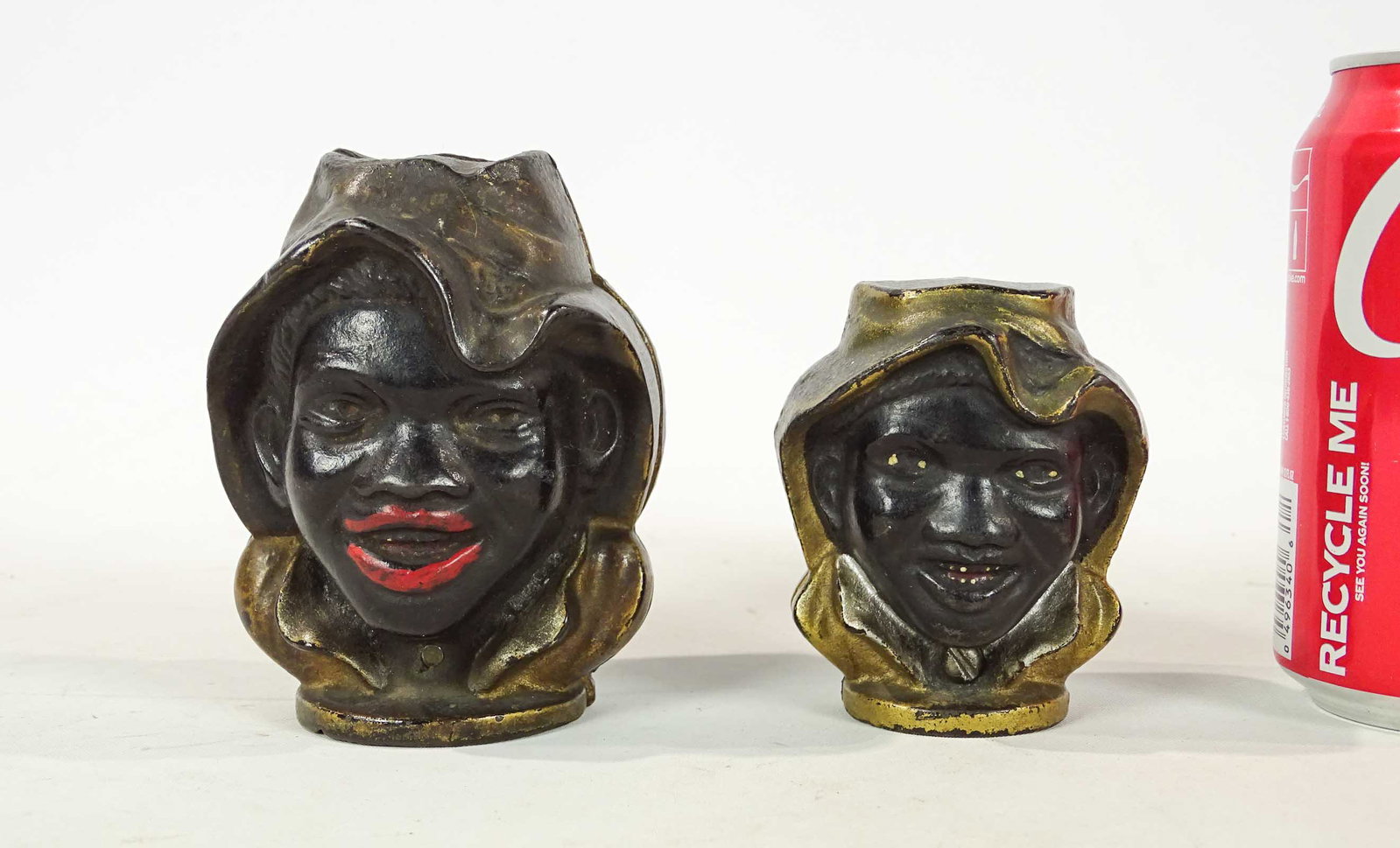 Bank Lot: Lot (2) banks, both cast iron Two Faced Boys, 3 1/8" and 4 1/8" Ht., 1901, #83, #84 Penny Bank Book, Mfg. A.C. Williams.