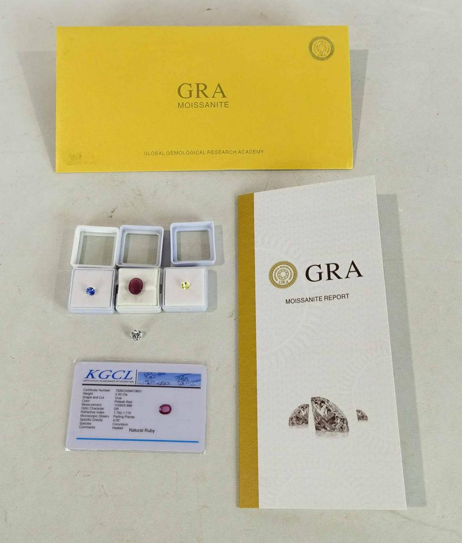 Misc. Lot: Lot including Moissanite gem in folder, Natural ruby, (2) Sri Lanka sapphires.