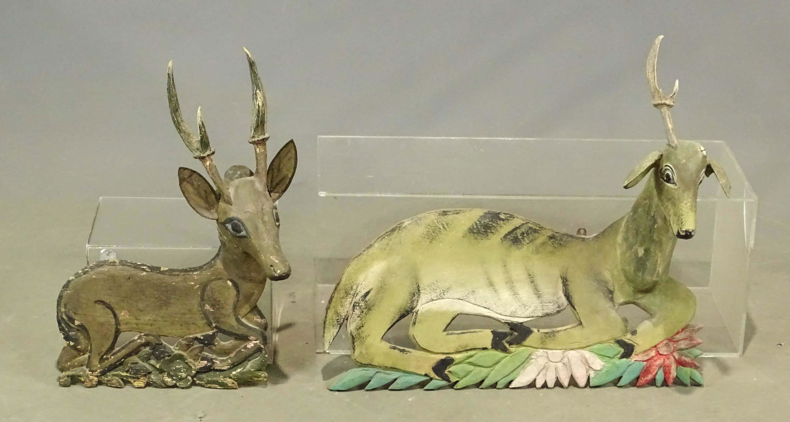 Folk Art Carvings: Lot (2) folk art painted deer carvings. Largest 25 1/2" x 23". Real antlers, one antler needs to be reattached.
