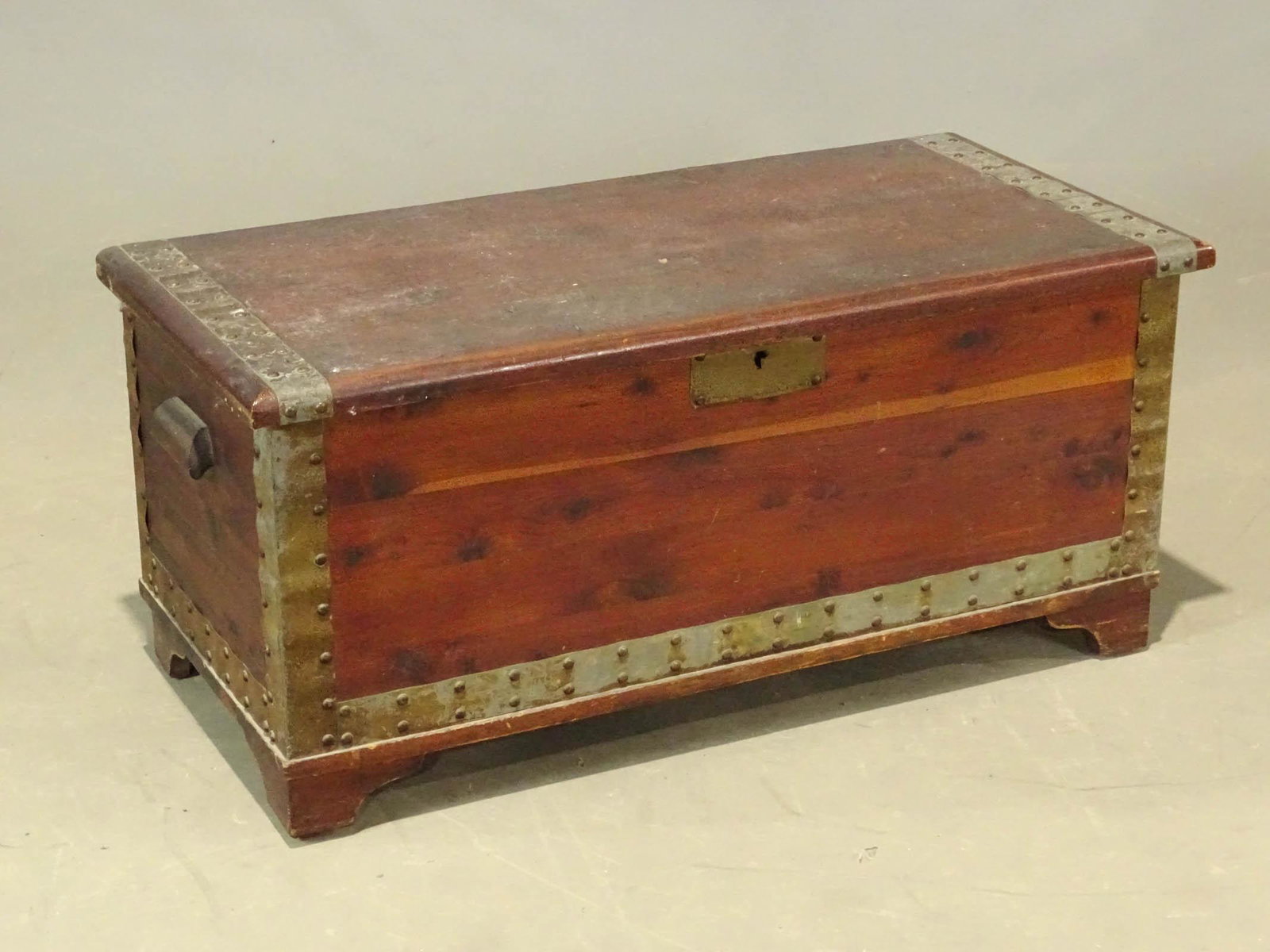 Cedar Chest: 20th Century cedar chest with brass straps. 42" x 20" x 19 1/2" Ht..