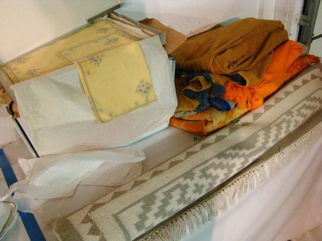 Textile Lot: Misc. textile lot including throw rug, 2 scatter rugs and misc. linens.